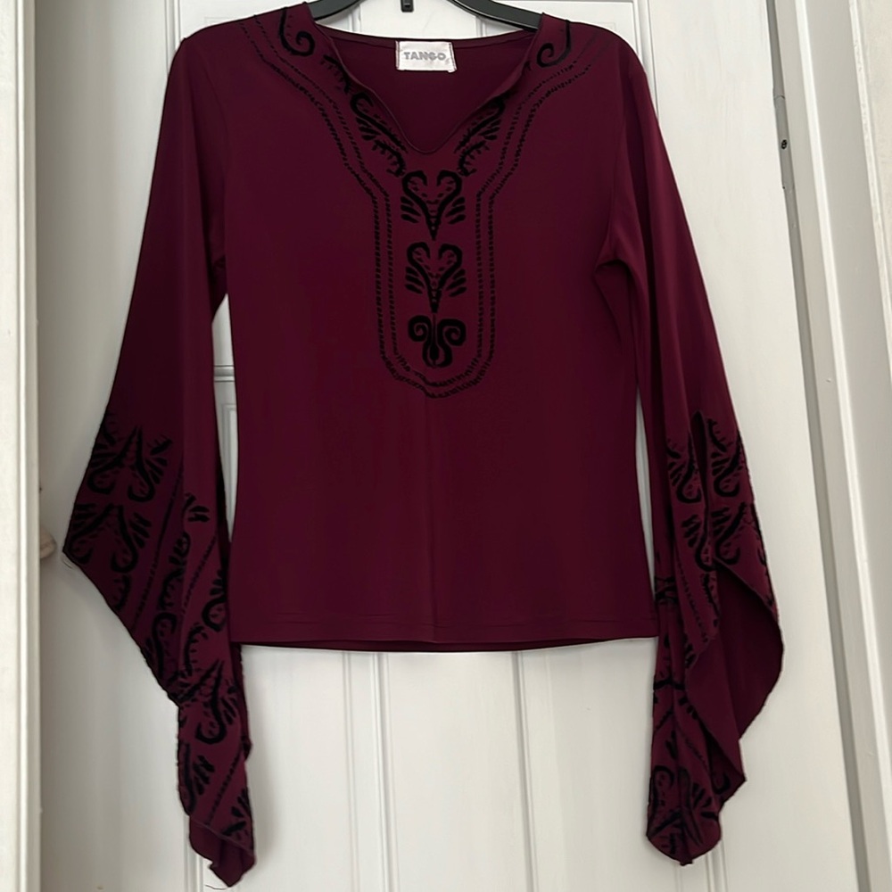 Beautiful, new woman blouse by Tango. Color burgundy.